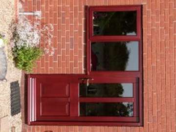 NESTON. CHSHIRE . Installtion of G. barnsdales Timber window and door fabricated in Red Gradis Hardwood, stained Mahogany to match existing Hardwood frames. All Timber windows and doors Come pre painted or stained.